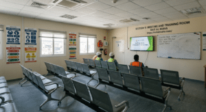 Meeting and training room porta cabin on a Dubai construction site — daily toolbox talks and HSE inductions